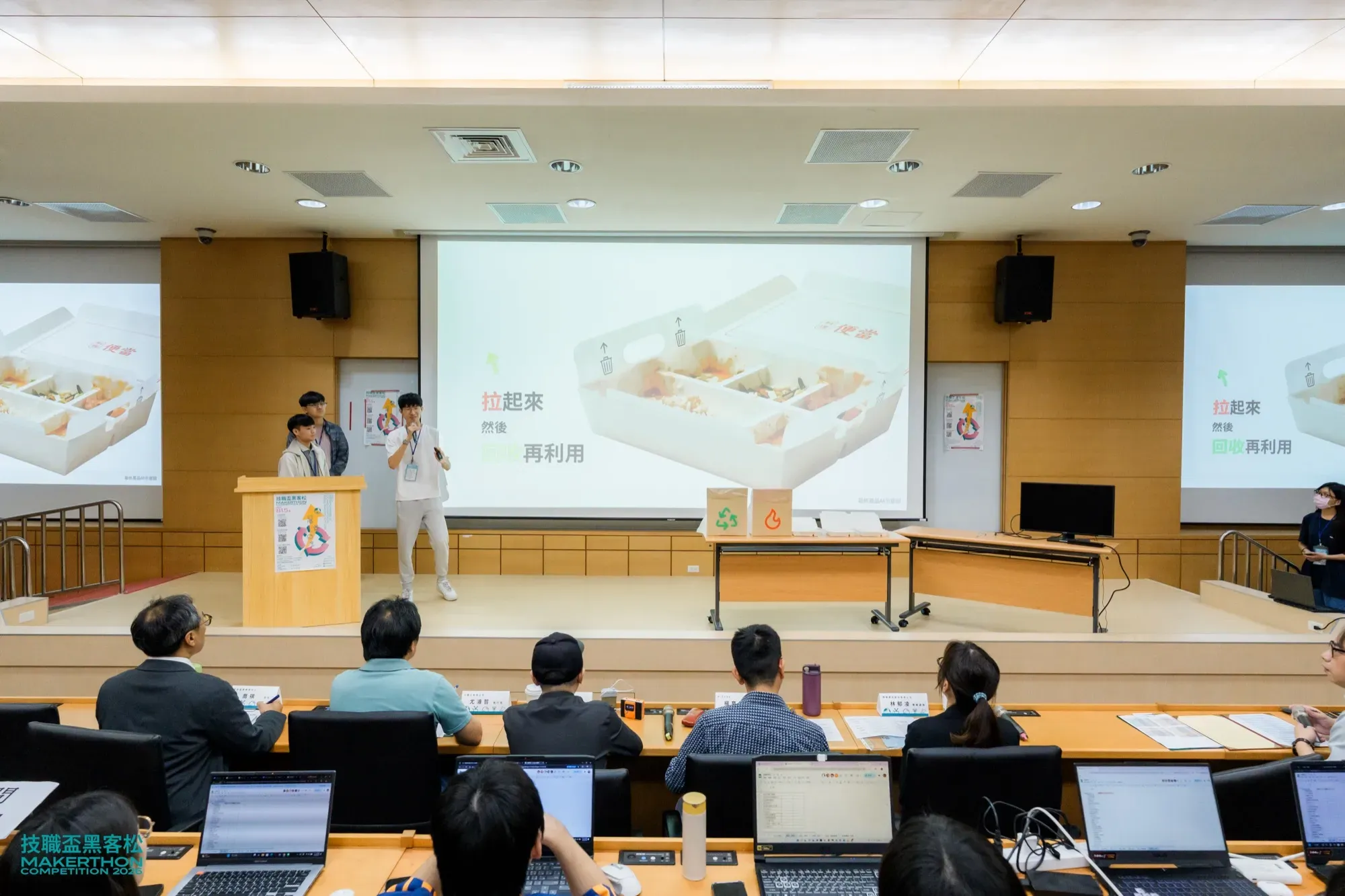 Pitching a recyclable lunch box to the judges on stage
